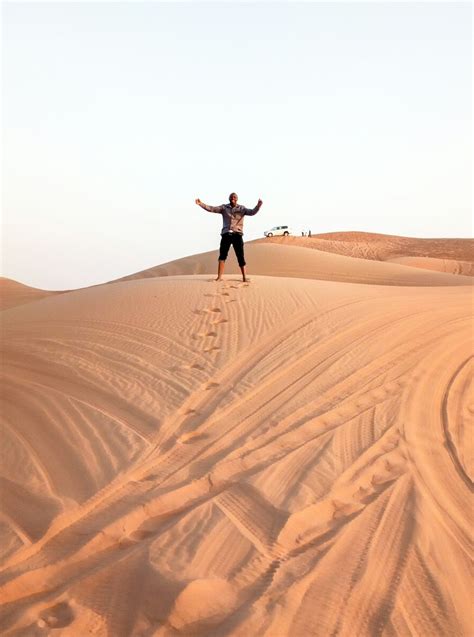 Man Standing On Brown Desert During Daytime Photo Free White Image On