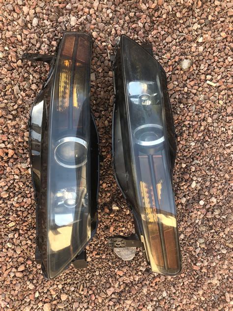 Sold: 04-06 acura tl headlights (blacked out and slightly tinted