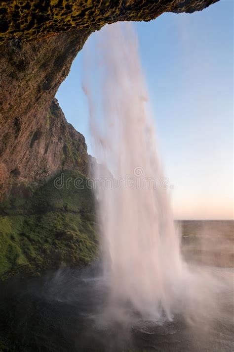 Sunset At The Back Of Seljalandsfoss Waterfall In Iceland Stock Image