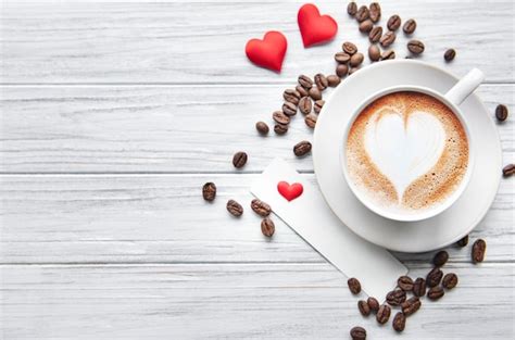 Premium Photo A Cup Of Coffee With Heart Background