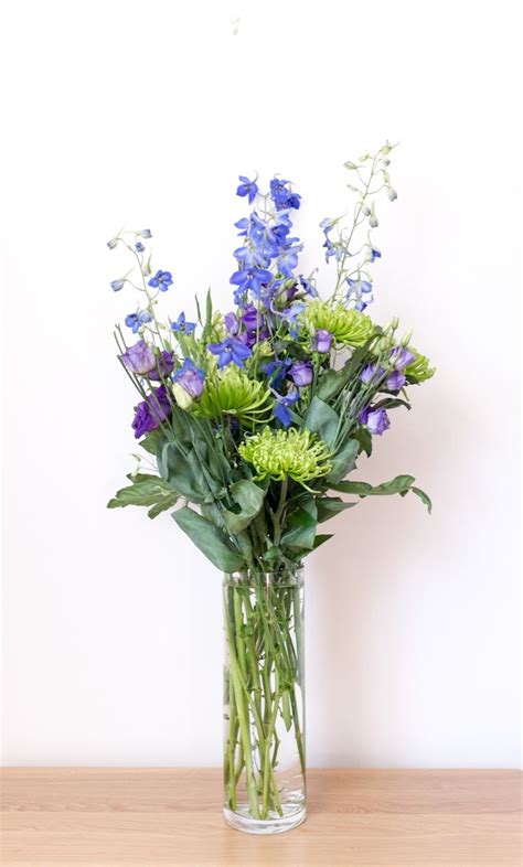 Wild Flower Arrangement In Blues Greens And Purples With Shamrock