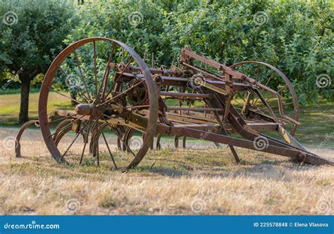 Old Rustic Farm Equipment Lies Abandoned In A Field Stock Photo Image