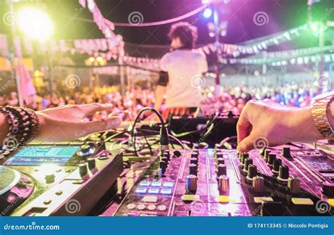 Dj Mixing Outdoor At Beach Party Festival Outdoor With Crowd Of People