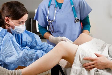 What is a doctor called that delivers babies. Midwife saves unborn baby by keeping her hand up mum's ...