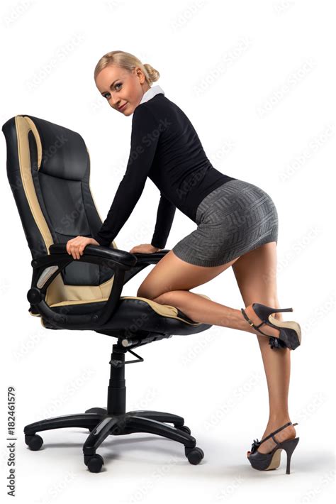 sexy blonde secretary posing with the office chair stock foto adobe stock