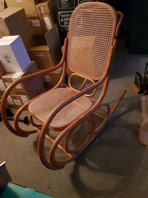 Free Rocking Chair. Wood with wicker back and seat. Good vondition