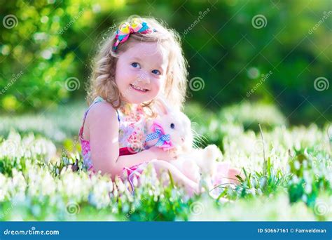 Little Girl Playing With A Rabbit Stock Image Image Of Curly People