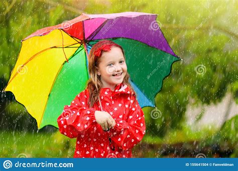 Kid With Umbrella Playing In Summer Rain Stock Photo Image Of Little