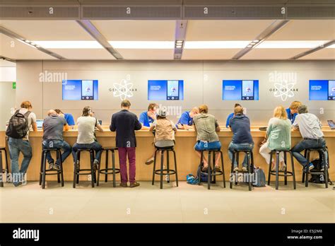 Customer support at the Genius Bar in the Apple Store, London, England