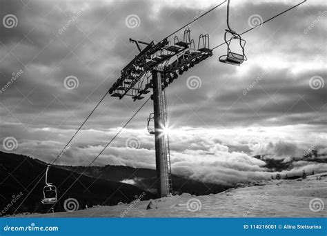Black And White Mountains Landscape With Ski Lift Sunrise Over
