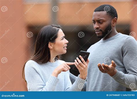 Woman Asking For Explanation About Phone Text To A Man Stock Image