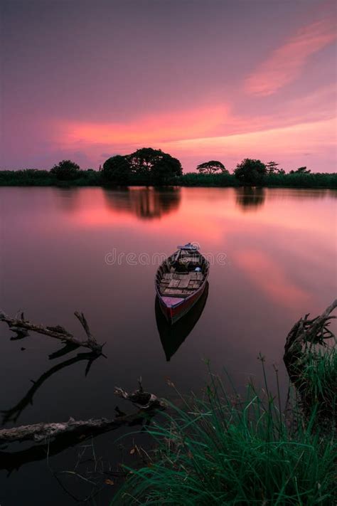Sunset At Tanjung Burung Lake With Boat And Beautiful Tree Stock Image