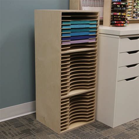 A Wooden Cabinet With Many Different Colored Fabrics On Its Shelves
