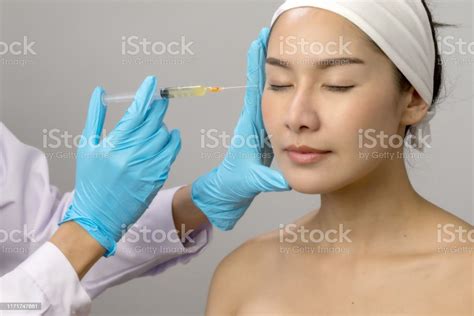Treatment With Botox Concept Asian Woman Receiving Botox Injection