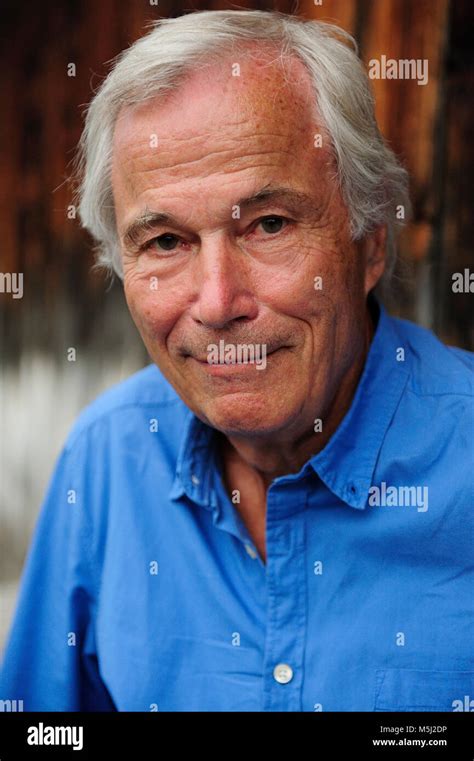 Portrait Of Smiling Senior Man Wearing Blue Shirt Stock Photo Alamy