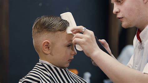 Hairdresser Giving Stylish Haircut To Young Stock Footage Sbv 322289994