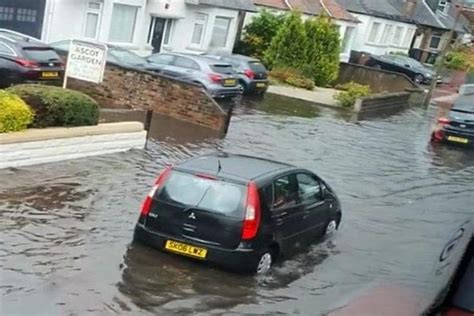 Uk Weather Motorists Left Stranded On Top Of Cars As Heavy Rain And