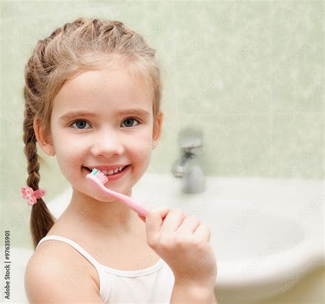 Smiling Cute Little Girl Brushing Teeth Photos Adobe Stock