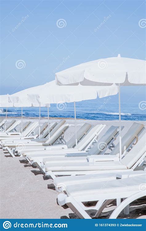Beautiful Beach Chairs On The Sandy Beach Near The Sea Stock Image
