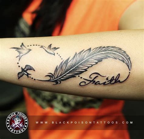 amazing feather tattoo with birds and faith letters in shape of infinity inked by black poison