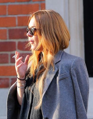 Lindsay Lohan Takes Smoking Break Outside Of London Hotel