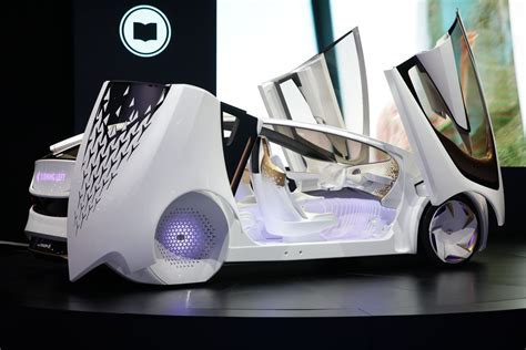 The Futuristic Car Is On Display At An Event