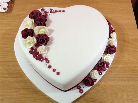 Heart Shaped Wedding Cake With Whimsical Flowers Fondant Covered