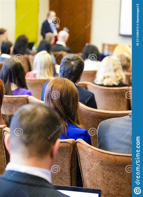 Businesspeople On Conference Male Presenter Speaking In Front Of The
