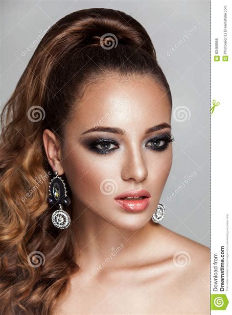 Beauty Brunette Fashion Model Girl With Long Healthy Curly Brown Hair Ponytail Stock Photo