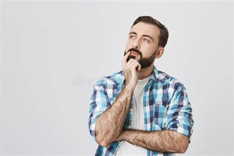 Idea And Thought Concept Curious Man With Beard And Stylish Haircut Standing Over Gray