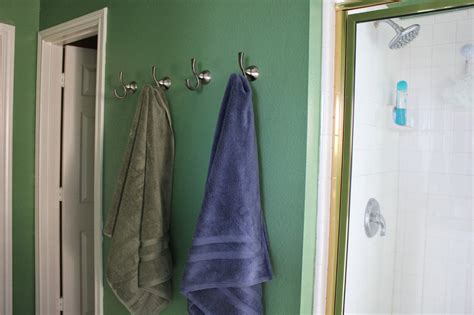 Matching towel bars and hooks in bathroom hardware sets will add a decorative look. Bathroom Towel Hooks Ideas and Materials - MidCityEast