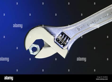 Adjustable Wrench With Nut Stock Photo Alamy