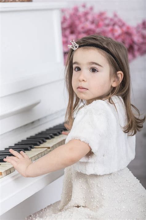Beautiful Young Little Girl Playing The Piano Stock Photo Image Of