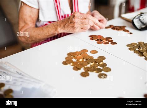 Woman Counting Coins Stock Photo Alamy
