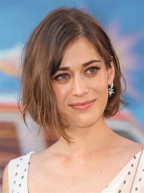 lizzy caplan s bob hairstyle with one side tucked behind the ear