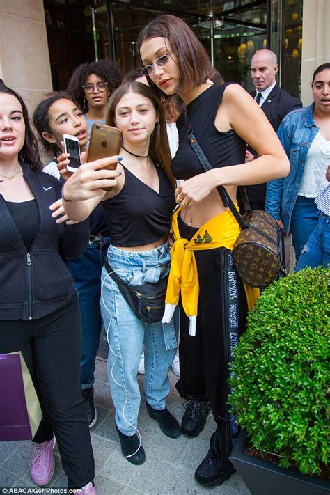 bella hadid wears a tiny crop top as she steps out in paris daily mail online