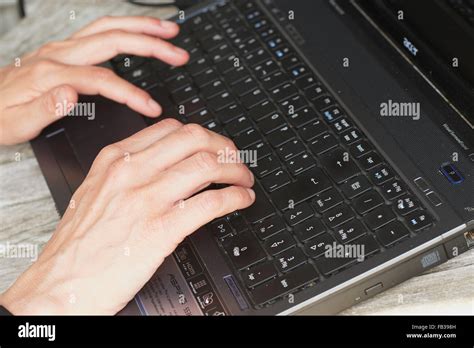 Person Typing On A Laptop Stock Photo Alamy