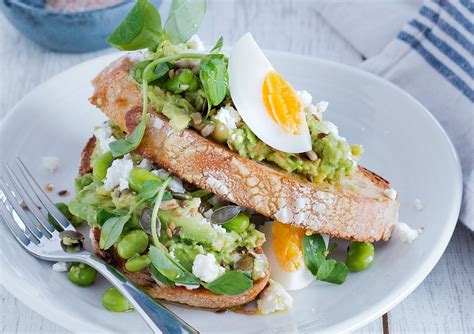 Crushed Avocado And Broad Bean Sourdough Toast With Feta And Egg