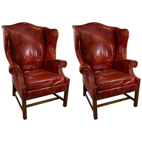 The design features of the leather wing back chair offer a few creature comforts, as listed below: Midcentury Pair of Burgundy Leather Wing Chairs by Baker