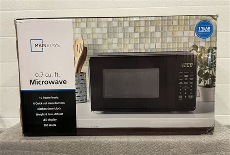 Ossauctions Mainstays 07 Cu Ft Compact Countertop Microwave Oven Black