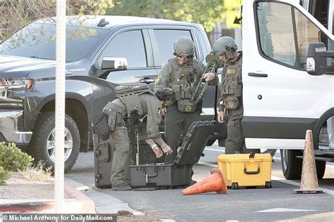 shocking moment heavily armed swat team surrounds the home of las vegas official before his