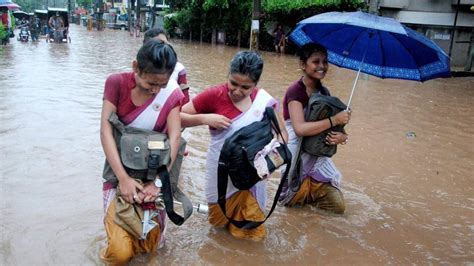 Photos Assam Incessant Rain Floods Bring Normal Life To Standstill