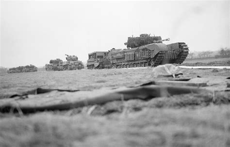 A Column Of Churchill Tanks And Other Vehicles At The Start Of