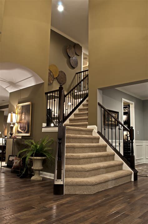 Enjoy This Two Story Foyer With A Beautiful Staircase In Your New Home