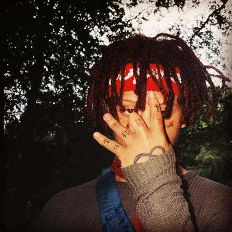 Download Trippie Redd Striking A Pose Against A Vibrant Background