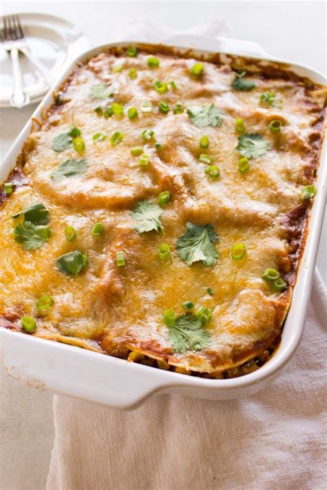 layered chicken enchilada casserole with flour tortillas this easy chicken enchilada casserole