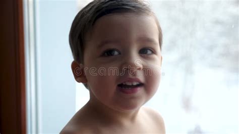 Little Baby Boy Sitting On Window In White Towel Stock Footage Video