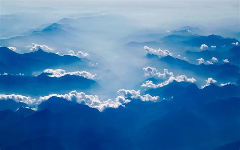 1680x1050 Mountains Countryside Fog Clouds Haze Sky Sunrise 1680x1050