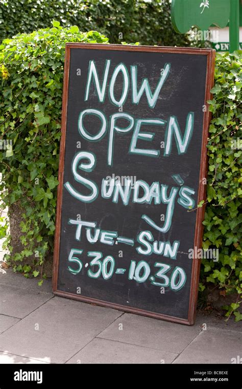 Cafe Sign Now Open Sundays Stock Photo Alamy