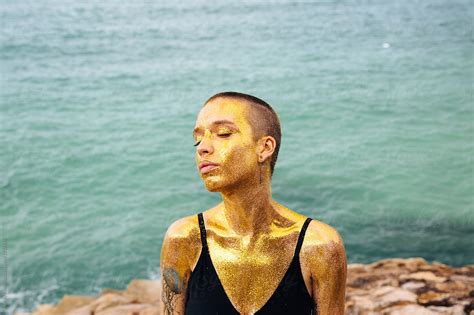 Portrait Of Woman With Gold Glitter On Her Body By Stocksy Contributor Andrey Pavlov Stocksy